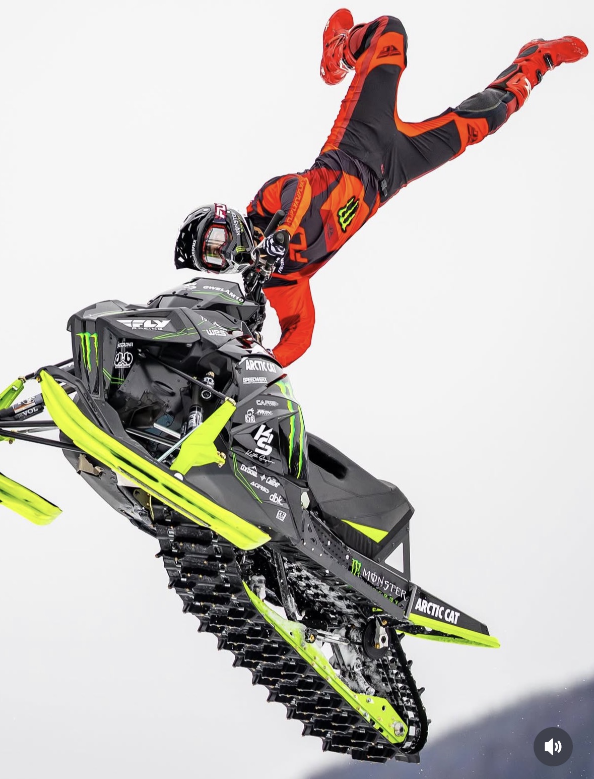 Willie Elam extended trick in orange gear on Monster Energy Arctic Cat